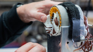 hands working on a machine